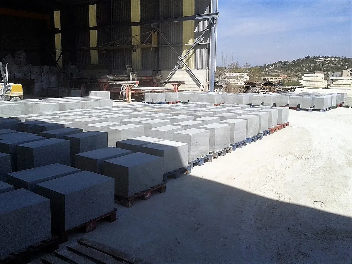 Stone blocks on pallets in the company yard