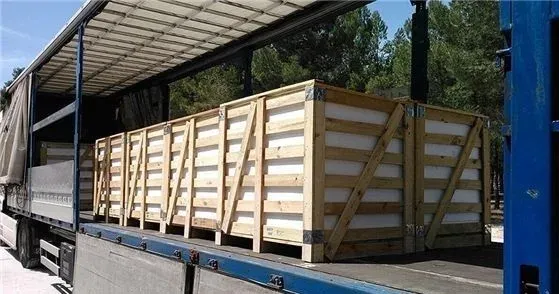 Wooden crates of stone pieces loaded on a lorry