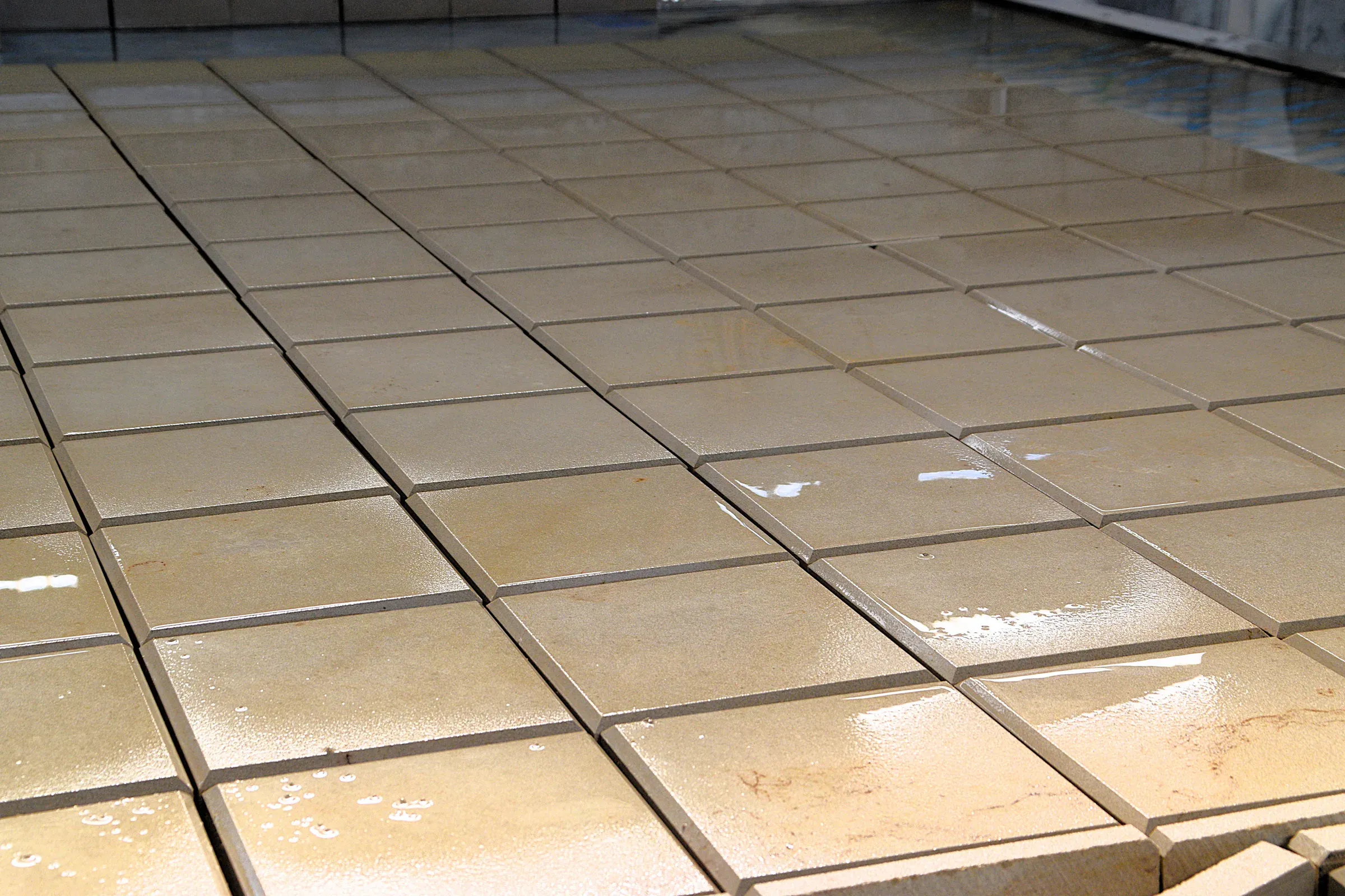 Finished, wet sandstone tiles in the workshop